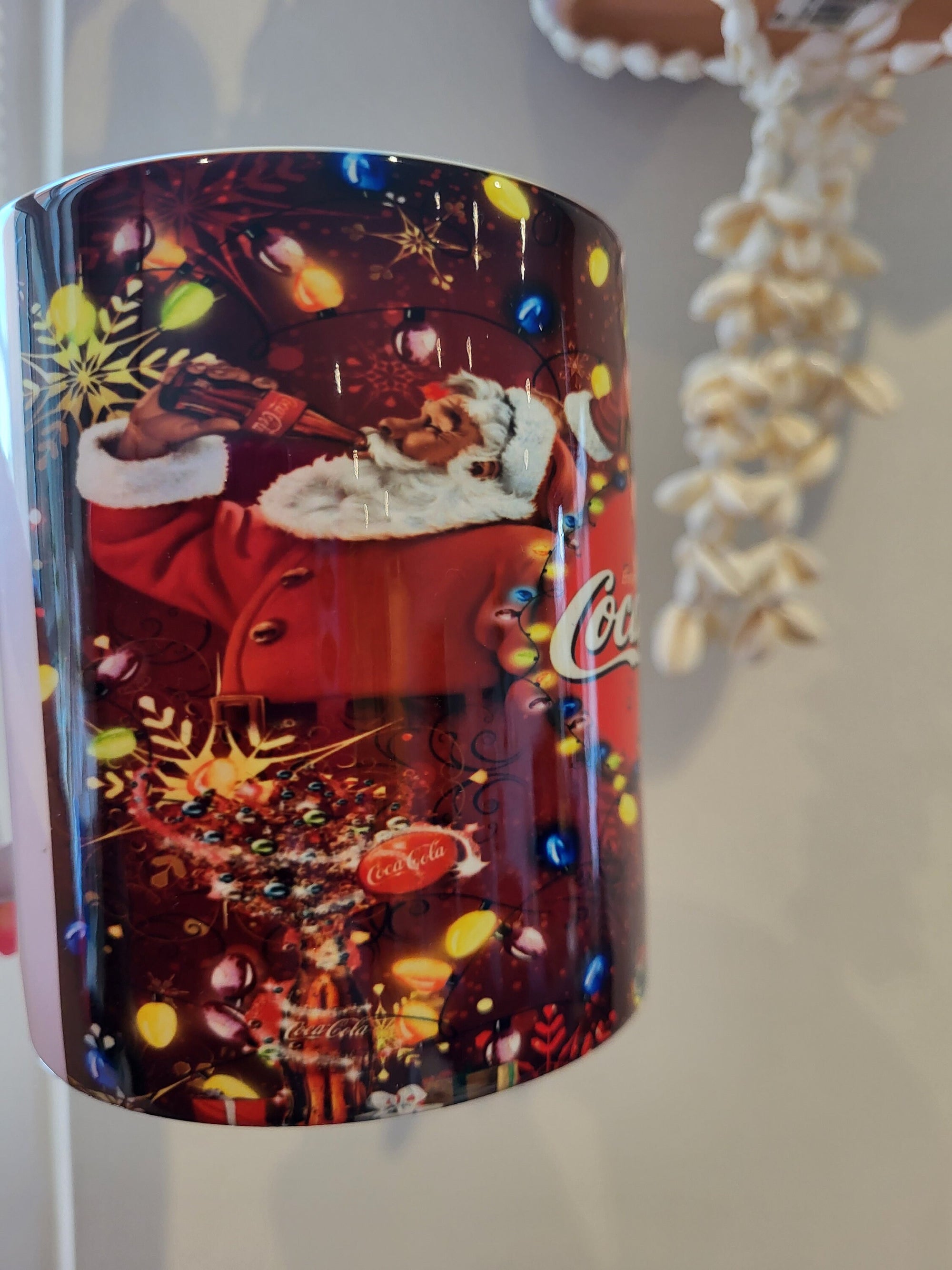 Coca-Cola Santa Mug: Christmas Lights & Holiday Cheer with Santa Claus Drinking Coke by a Christmas Tree