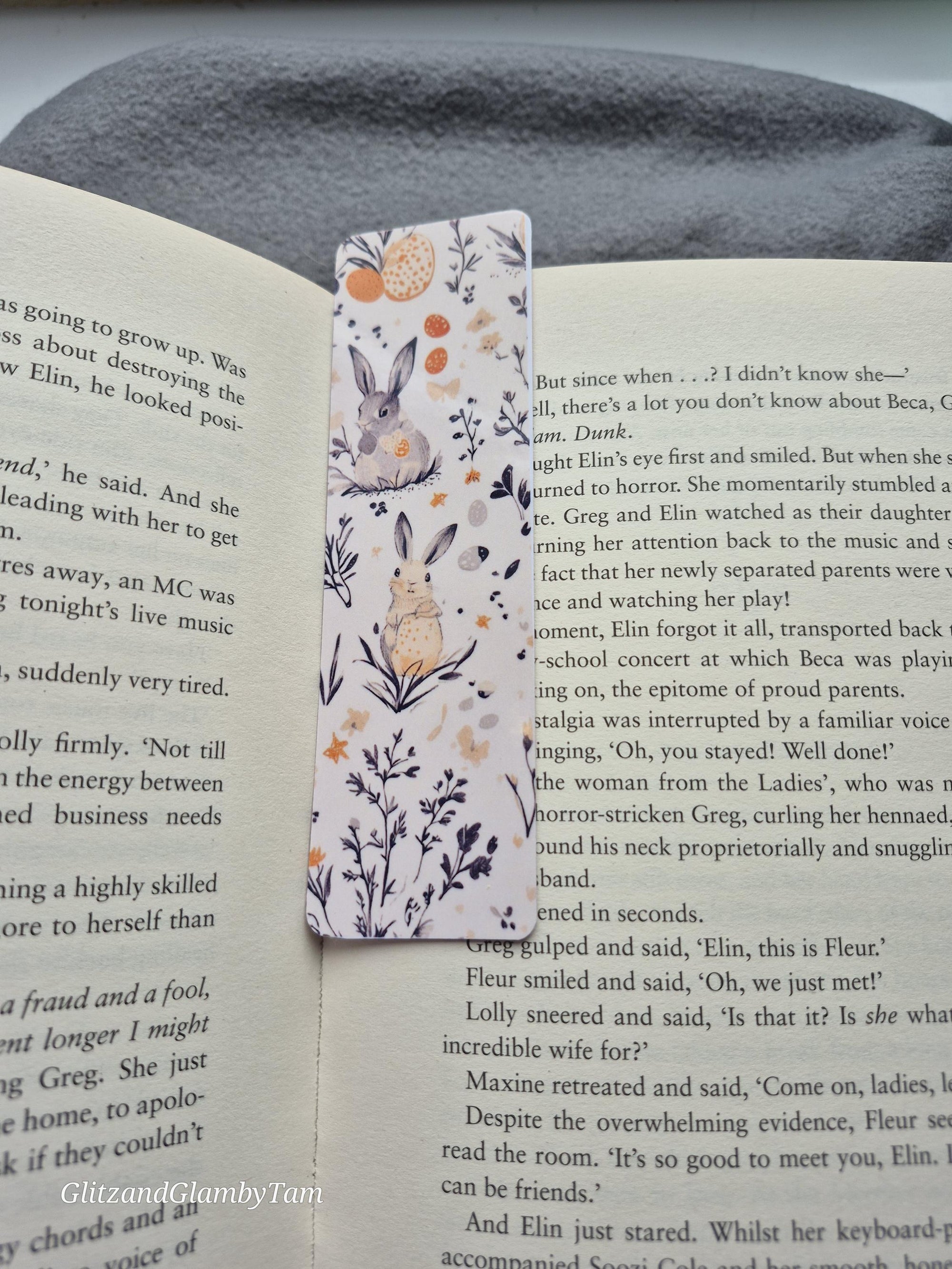 Open book with rabbit and floral bookmark. Reading aesthetic.