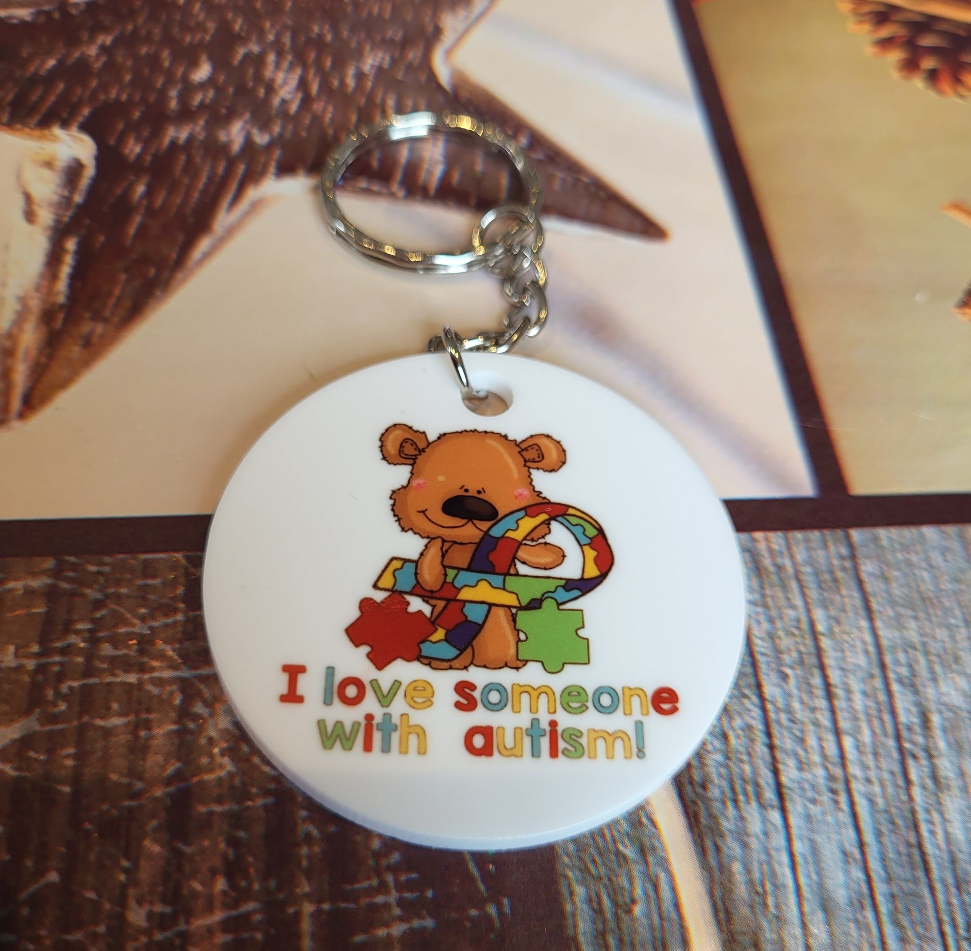 Autism Awareness Keychain: Teddy Bear with Puzzle Ribbon - I Love Someone with Autism!