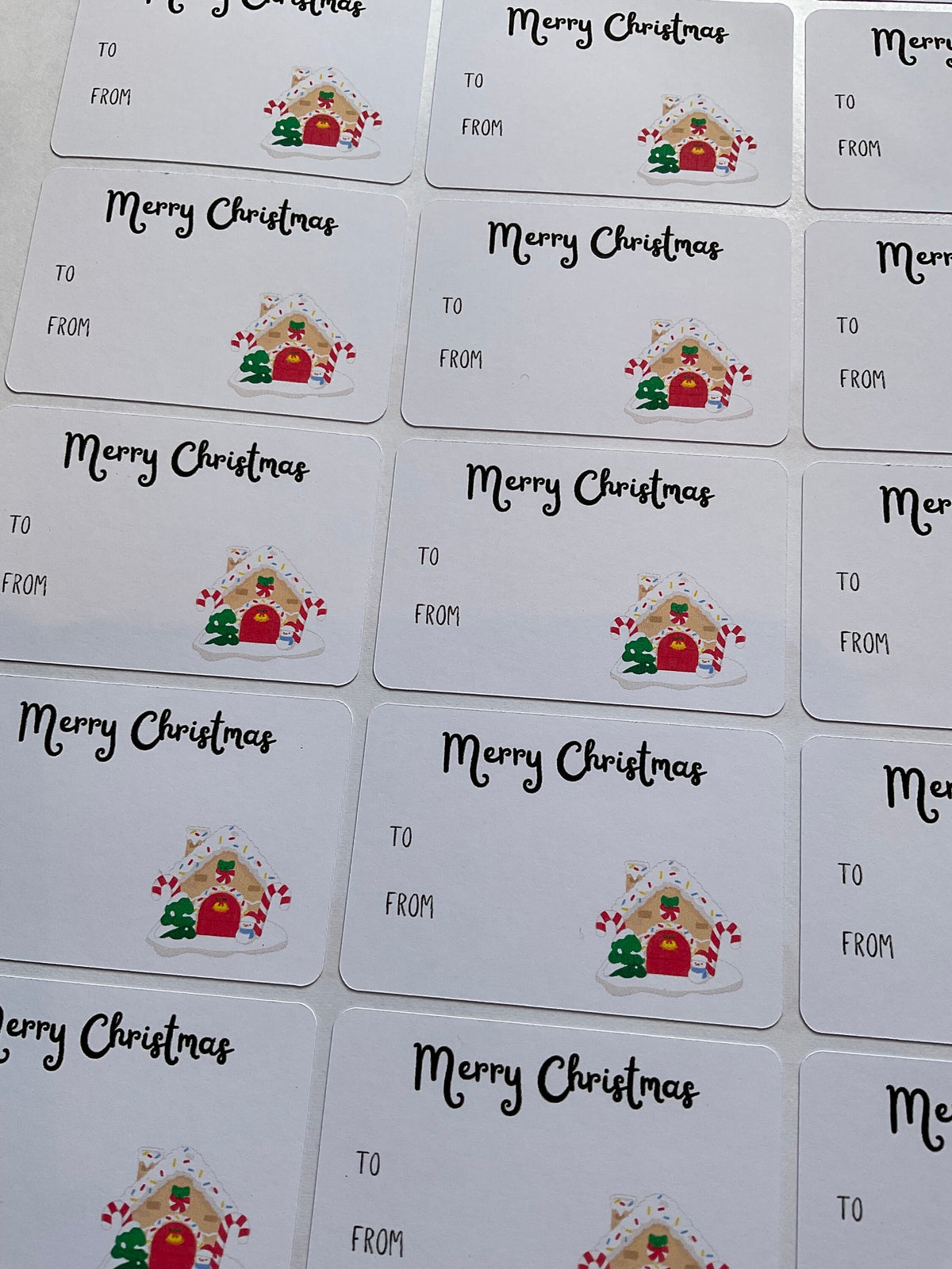 Merry Christmas gift tags with gingerbread house design for holiday presents.
