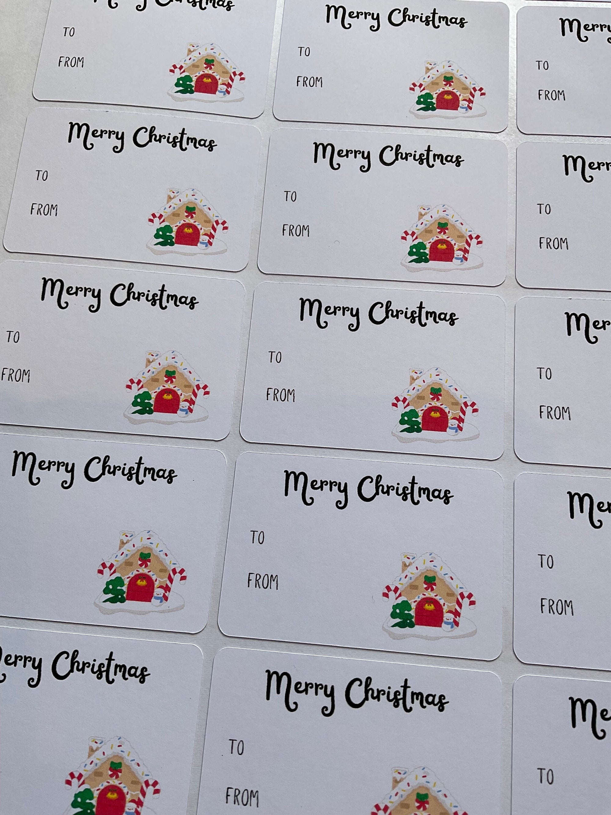 Merry Christmas gift tags with gingerbread house design for holiday presents.