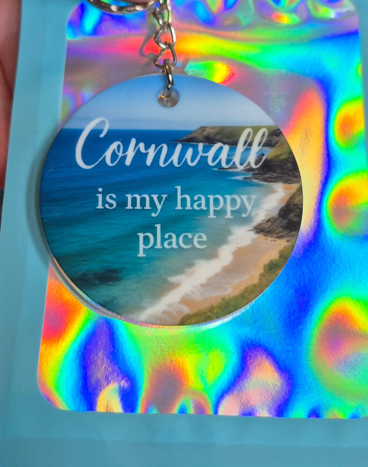 Cornwall Is My Happy Place Keyring – Coastal Gift – Round Acrylic Keyring with Beach Photo – Handmade Cornish Souvenir in Holographic Pouch