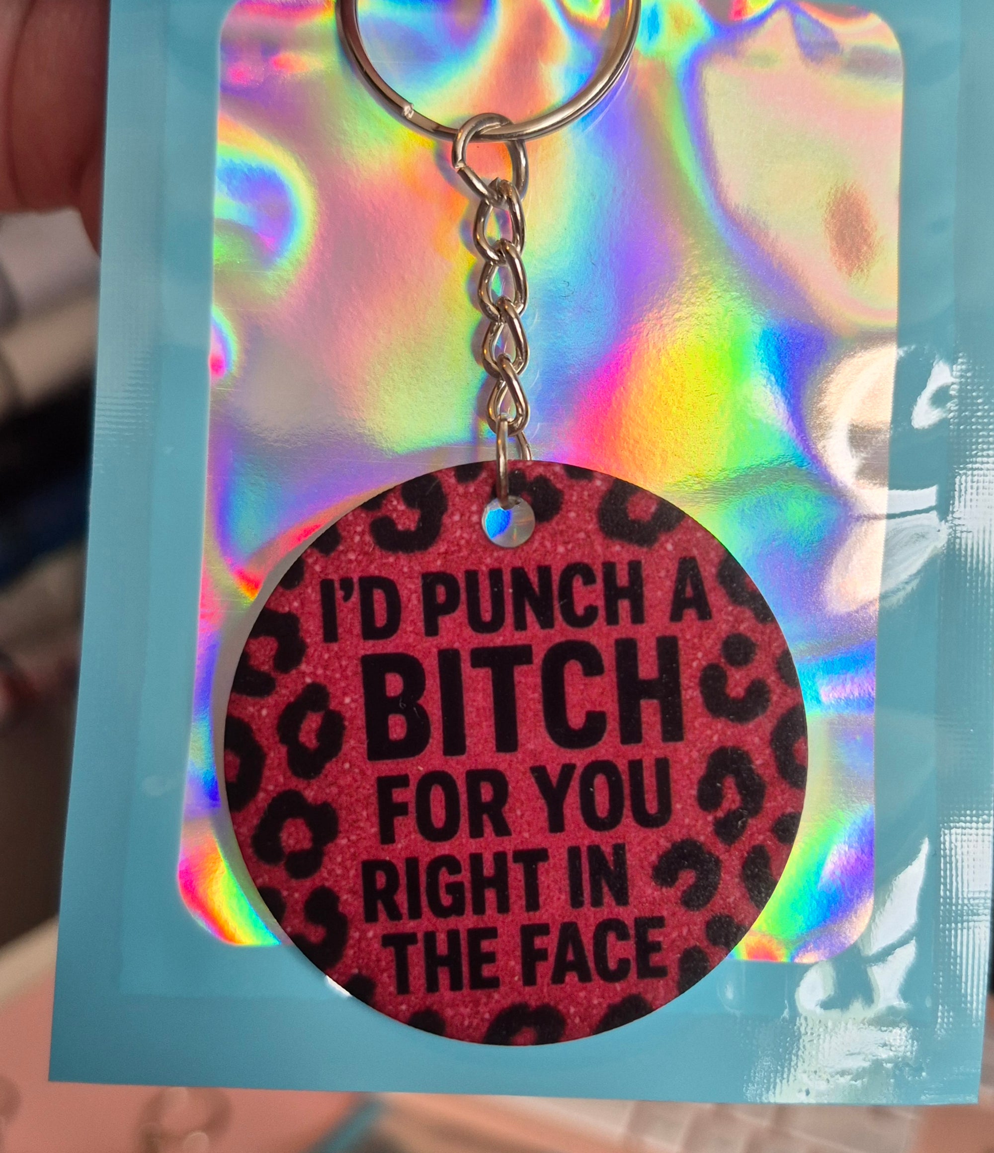 I’d Punch a B**ch for You Keyring – Bold Funny Leopard Print Gift – Round Acrylic Keyring with Pink Glitter Look – Sass Bestie Gift in Holographic Pouch