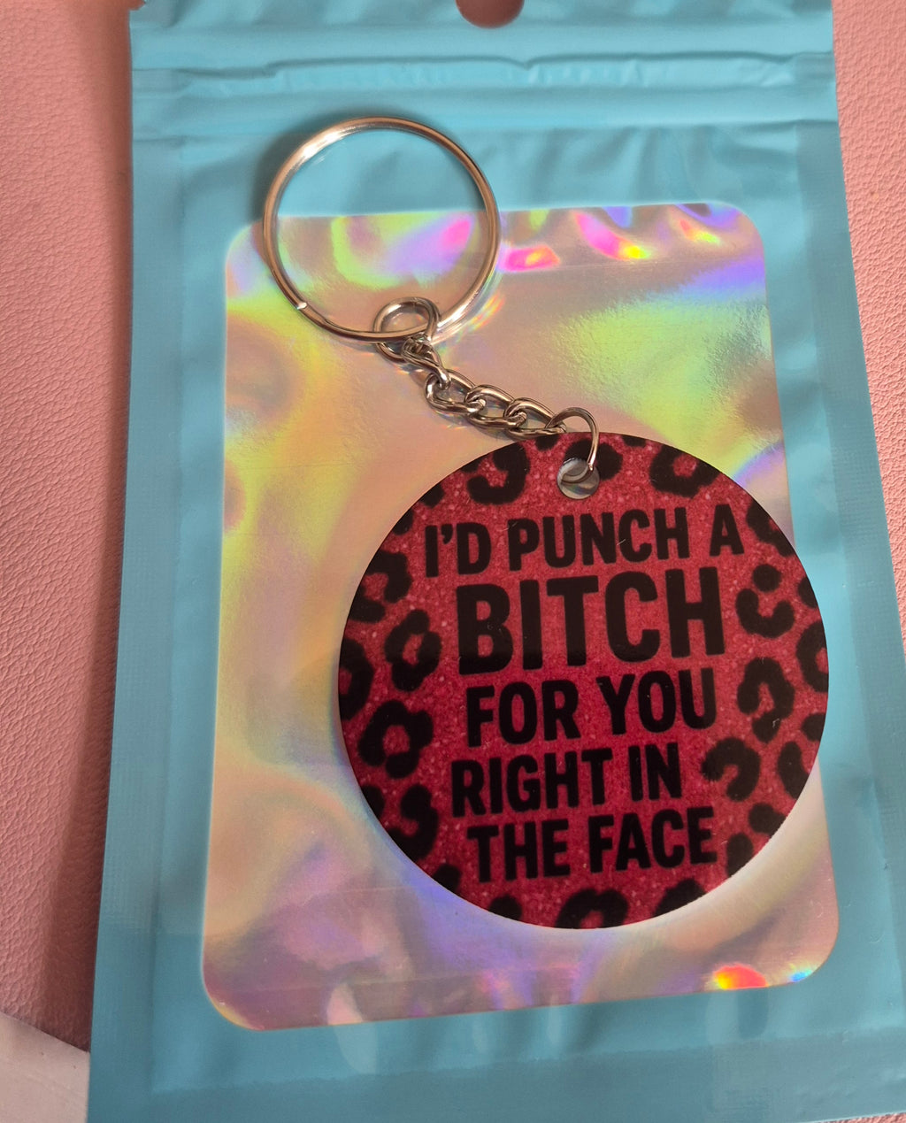 I’d Punch a B**ch for You Keyring – Bold Funny Leopard Print Gift – Round Acrylic Keyring with Pink Glitter Look – Sass Bestie Gift in Holographic Pouch
